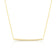 Yellow gold pave diamond bar necklace on a white background