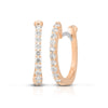 The CLASSIC DIAMOND PAVE DIAMOND HUGGY EARRINGS by Roberto Coin feature rose gold hoops with a row of pavé round diamonds. One earring faces front, while the other shows the side profile and clasp for added detail.