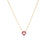 The Roberto Coin TINY TREASURES REVERSIBLE HEART NECKLACE features a delicate gold chain and a small open heart pendant with pink gemstones, centered against a plain white background.
