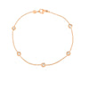 Rose gold bracelet featuring 5 diamond stations on a white background