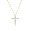 Yellow gold diamond cross necklace on a white background