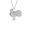 The TINY TREASURES DIAMOND ROOSTER NECKLACE by Roberto Coin features a rooster pendant encrusted with diamonds, hanging from an 18K white gold chain, and shines brightly against a white background.