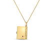Yellow and white gold necklace showing back cover of book pendant featuring a ruby on a white white background