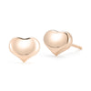The TINY TREASURES HEART STUD EARRINGS by Roberto Coin are shiny 18K gold studs with a smooth finish, ideal for everyday wear and elegantly displayed on a white background.
