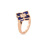 The Roberto Coin VENETIAN PRINCESS DIAMOND AND LAPIS SMALL FLOWER RING in 18K rose gold features a flower-shaped design with blue lapis petals and four diamonds at the center, beautifully shown on a white background.