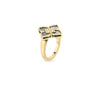 The VENETIAN PRINCESS DIAMOND AND MALACHITE SMALL FLOWER RING by Roberto Coin features 18K yellow gold, a four-petal flower with black inlays, malachite accents, central diamonds, and a red gemstone on the band—all shown on a white background.