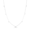 White gold necklace with 7 diamond flower stations on a white background