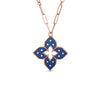 The VENETIAN PRINCESS DIAMOND AND TITANIUM FLOWER LONG NECKLACE by Roberto Coin features a flower-shaped pendant with blue enamel, white dot accents, and a scalloped gold border on a gold chain.