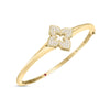 The VENETIAN PRINCESS PAVE DIAMOND FLOWER KNIFE EDGE BANGLE by Roberto Coin features an 18K yellow gold design with a diamond-encrusted floral centerpiece, elegantly displayed on a white background.