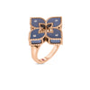 The Roberto Coin VENETIAN PRINCESS DIAMOND AND TITANIUM SMALL FLOWER RING features a delicate flower motif with diamonds, crafted in titanium and 18K rose gold, set on a polished band.