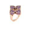 The VENETIAN PRINCESS DIAMOND AND TITANIUM SMALL FLOWER RING by Roberto Coin showcases a delicate flower motif with diamonds on its titanium petals, accented with gold rope edges, set on an 18K rose gold band.