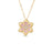 The Roberto Coin VERNAZZA DIAMOND AND PINK OPAL FLOWER NECKLACE showcases an elegant flower pendant in 18K yellow gold, with pink enamel petals, gold edges, and a sparkling cluster of diamonds at the center.
