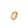 The PRINCESS DIAMOND AND EMERALD SATIN FINISH RING by Roberto Coin is a wide 18K yellow gold band with intricate engravings, set with green, red, and white gemstones, shown on a white background.
