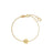 Yellow gold flower bracelet with diamond accent on a white background