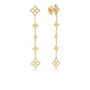 The PRINCIPESSA DIAMOND AND FLOWER STATION DANGLE EARRINGS by Roberto Coin showcase three openwork flower motifs on an 18K yellow gold chain, each centered with a sparkling diamond for elegant floral charm.