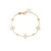 The PRINCIPESSA DIAMOND AND FLOWER STATION BRACELET by Roberto Coin features a delicate gold chain with five diamond-accented floral motifs and an adjustable clasp, blending timeless elegance with signature design.