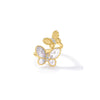 Front view of a yellow gold double butterfly bypass ring with diamonds and mother of pearl on a white background