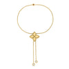 Yellow and gold bracelet with flower charm and diamond accents ends on a white background