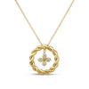 Yellow gold necklace with twist circle and dangling diamond flower pendant on a white background