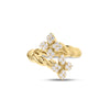 Front view of yellow gold twist bypass ring with diamond flower ends on a white background