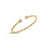 Yellow gold twist bangle with diamond flower ends on a white background