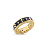 Side view of yellow gold and black enamel ring with diamond accents on a white background
