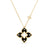 Yellow gold and black enamel flower necklace with diamond accents on a white background