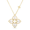 Yellow gold and white enamel flower necklace with diamond accents on a white background