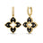 Yellow gold and black enamel flower dangle earrings with diamond accents on a white background