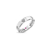 Side view of white gold ring with diamond floral motif accents on a white background