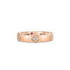 Front view of rose gold ring with diamond floral motif accents on a white background