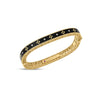 Yellow gold and black enamel bracelet with diamonds on a white background