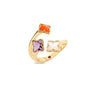 Side view of yellow gold three flower ring with amethyst, mother of pearl, and red agate on a white background