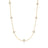 Yellow gold necklace with mother of pearl flower stations on a white background