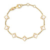 Yellow gold bracelet with mother of pearl flower stations on a white background