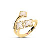 Side view of yellow gold three flower mother of pearl ring on white background