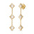 Yellow gold dangle earrings with mother of pearl flower stations on a white background