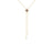 Gold lariat necklace with four-pointed gemstone pendant in center and two hanging diamond drops at ends.
