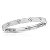 White gold bangle with diamond flower motifs on a white background