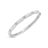 The LOVE IN VERONA Narrow Width Diamond Accent and Satin Finish Bangle by Roberto Coin features clustered diamond accents, a brushed satin finish, and a hidden pink gemstone—an elegant, timeless addition to any jewelry collection.