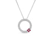 The LOVE IN VERONA PAVE DIAMOND AND RUBY CIRCLE NECKLACE by Roberto Coin features an 18K white gold circular pendant, pavé-set with diamonds and accented with three rubies clustered on one side for a delicate touch.