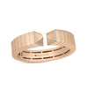The OBELISCO DIAMOND ACCENT BANGLE by Roberto Coin is an 18K rose gold geometric open-ended bangle with pavé diamond accents on each end and features the Roberto Coin logo with a small red gemstone inside the band.