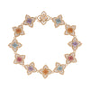 The VENETIAN PRINCESS CARNIVAL PAVE DIAMOND AND MIXED STONES FLOWER BRACELET by Roberto Coin features floral links with pastel gems at the center, surrounded by pavé diamonds and arranged in a symmetrical circular pattern.