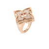 The VENETIAN PRINCESS PIROUETTE PAVE FLOWER RING by Roberto Coin Staging features a bold square floral design in 18K gold with diamond-encrusted petals and a central reddish-pink gemstone, evoking elegant Venetian style.