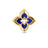 The VENETIAN PRINCESS PIROUETTE PAVE FLOWER RING by Roberto Coin Staging features a gold quatrefoil design with a floral motif, symmetrical petals, and deep lapis blue accents for an elegant touch.