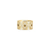 The VENETIAN PRINCESS ETCHED FRAME DIAMOND FLOWER RING by Roberto Coin is a wide 18K yellow gold band with an intricate geometric and floral design, accented by sparkling white diamonds. Set against a plain white background.