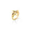 Side view of yellow gold flower ring with diamond accents on a white background