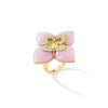 Side view of yellow gold, pink opal, and diamond floral ring on a white background