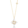 Yellow gold and mother of pearl flower necklace with diamond accents on a white background