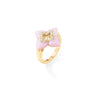 Side view of yellow gold and pink opal flower ring with diamond accents on a white background